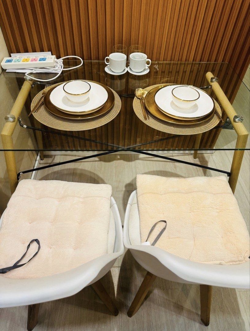 Fully Furnished Studio Unit for Rent (Category: Apartments & Condos) located in Manila. Submitted by bernalizahhhh (Listing ID 1465142123, Image 2). Description: - Cozy move-in ready studio unit - Includes a comfortable queen bed - Dining table set for two - Compact kitchen with microwave and mini fridge - Private bathroom equipped with a hot shower - Stylish warm wood slat accent wall and large wall mirror.