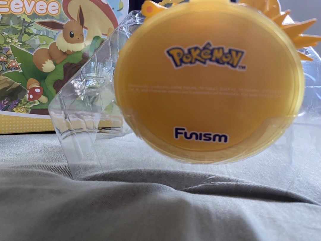 Funism Enjoy Eevee Series Jolteon Figure MX2302 (Category: Figurines & Statues) located in Manila. Submitted by map.b. (Listing ID 1465035014, Image 2). Description: - Brand: Funism - Series: Enjoy Eevee Series (No. 003 out of 009) - Character: Jolteon - Material: High-quality PVC and ABS - Condition: Box opened to check design only, figure is untouched and brand new - Inclusions: Complete with original box, clear plastic blister packaging, and c