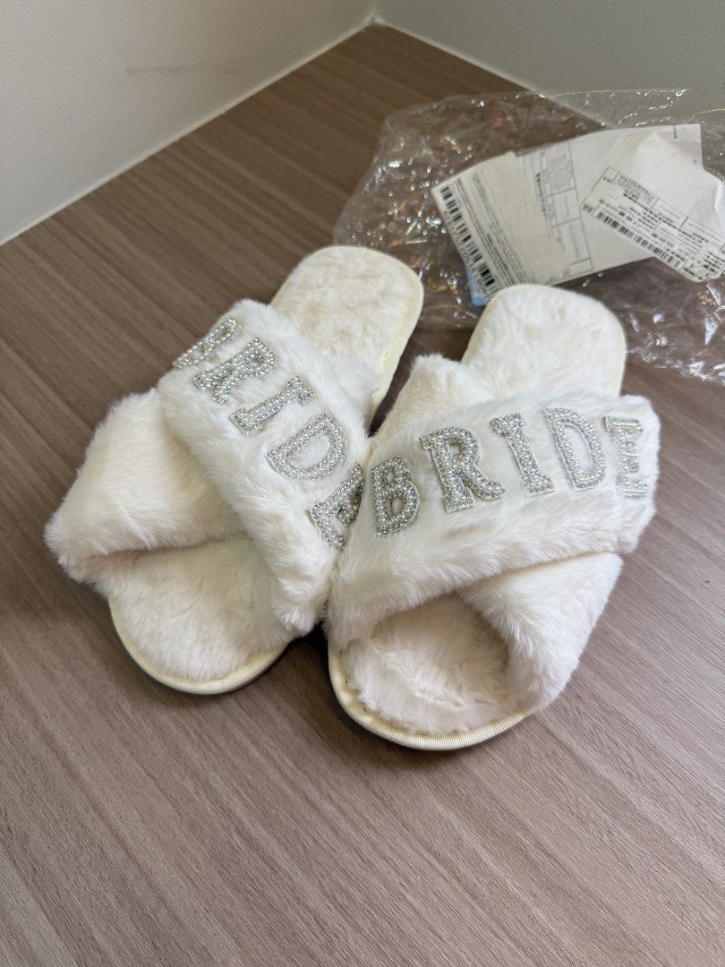 Fuzzy White Bridal Slippers with Rhinestone BRIDE Text (Category: Slippers and slides) located in Manila. Submitted by elisesnts (Listing ID 1465048009, Image 2). Description: someone gave me this for my wedding but didn’t get to use it 🥲 nice in person! .