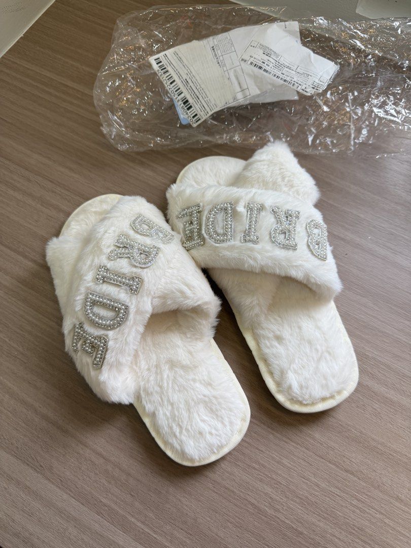 Fuzzy White Bridal Slippers with Rhinestone BRIDE Text (Category: Slippers and slides) located in Manila. Submitted by elisesnts (Listing ID 1465048009, Image 1). Description: someone gave me this for my wedding but didn’t get to use it 🥲 nice in person! .