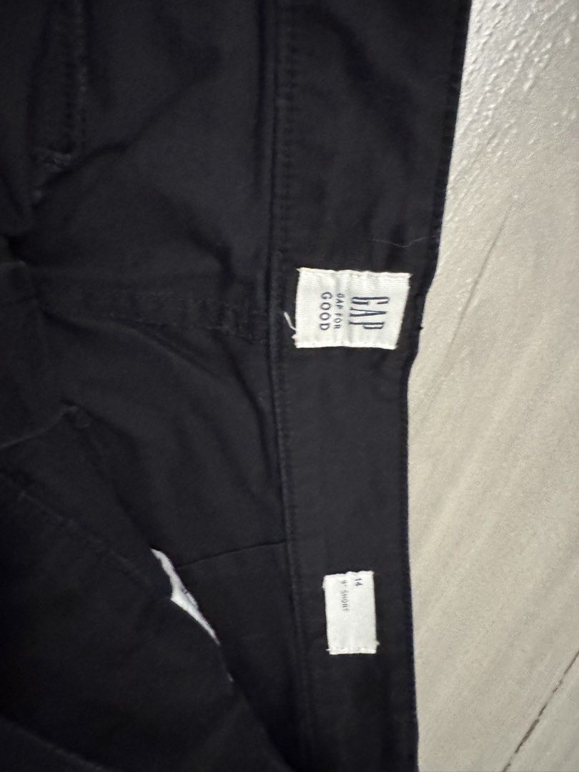 Gap Black Shorts Size 14 (Category: Shorts) located in Taguig. Submitted by sqaumejada (Listing ID 1465031663, Image 2). Description: - Brand: Gap - Color: Solid Black - Size: 14 (9-inch short style) - Material: Comfortable cotton blend with stretch - Fit: Mid-rise waist with zip fly and button closure - Details: Functional front and back pockets, standard belt loops, clean hems - Condition: Excellent, clean everyday casual wear.