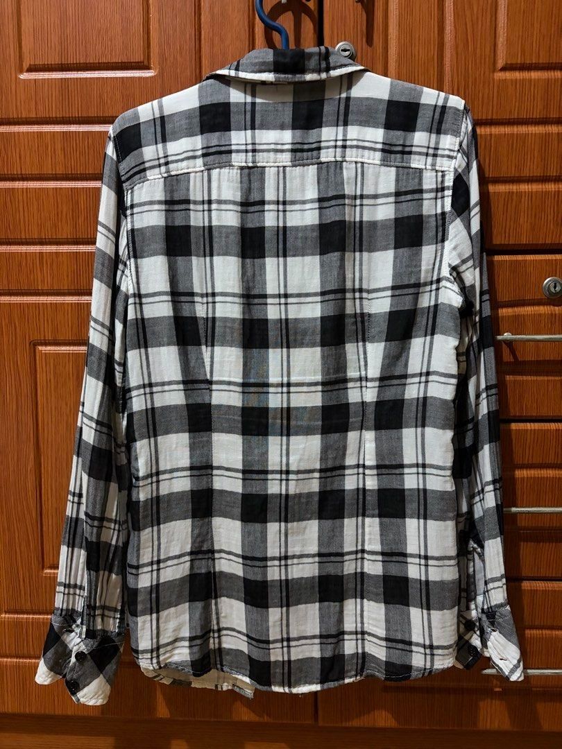 Gap Longsleeves XS - Small (Category: Longsleeves) located in Quezon City. Submitted by garagesale2026 (Listing ID 1465125684, Image 2). Description: - Preloved - In good condition - Classic black & white checkered shirt - XS on tag, fits up to Small.