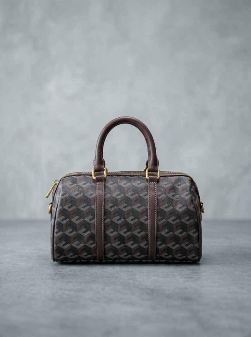Geometric Pattern Boston Handbag with Leather Trim (Category: Luxury Bags & Wallets) located in Davao. Submitted by nisa_chan04 (Listing ID 1465102096, Image 2). Description: - Style: Classic Boston barrel/doctor's bag with a structured silhouette - Print/Color: Geometric print in shades of grey and black - Hardware: Premium gold-tone hardware with dual top zip pullers - Details: Dual rolled leather top handles and protective vertical leather str
