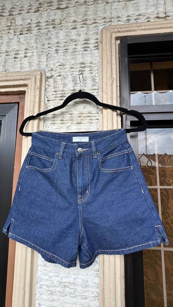 Giordano Denim Shorts Size S (Category: Shorts) located in Manila. Submitted by tmicmd1989 (Listing ID 1465048033, Image 2). Description: - Brand: Giordano - Style: High-waisted dark wash denim shorts with contrast stitching and side slits - Size: S (Fits 155/58A measurements) - Material: Comfortable blend of cotton, viscose, polyester, and other fibers - Condition: Clean, washed, and ready to wear - Care Tip: Wash inside out.