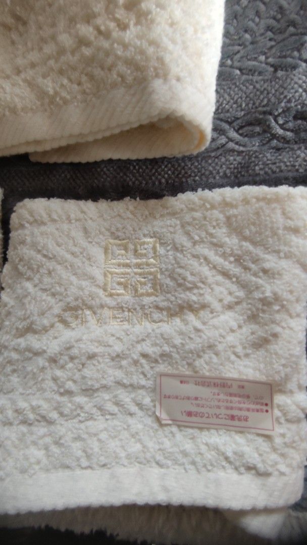 Givenchy Off-White Towel Set (Category: Bedding & Towels) located in Manila. Submitted by annetteasi22390 (Listing ID 1465011453, Image 2). Description: - Brand: Givenchy - Color: Creamy off-white - Set includes: 1 larger towel and smaller matching towels - Features: Textured pattern with embroidered logo and branding - Material: Soft plush fabric - Origin: Japanese care tags attached - Condition: Brand new / Great addition to any bathroom.