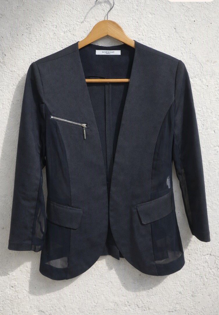 Givenchy Paris Collarless Open-Front Blazer (Category: Coats, Jackets and Outerwear) located in Baguio. Submitted by luxeloom099 (Listing ID 1464982265, Image 1). Description: Givenchy Paris Collarless Open-Front Blazer ​Elevate your wardrobe with this sleek black Givenchy Paris blazer. Featuring a modern collarless open-front design, structured tailoring, chic sheer side and lower panel accents, and decorative front pocket details with an edgy s