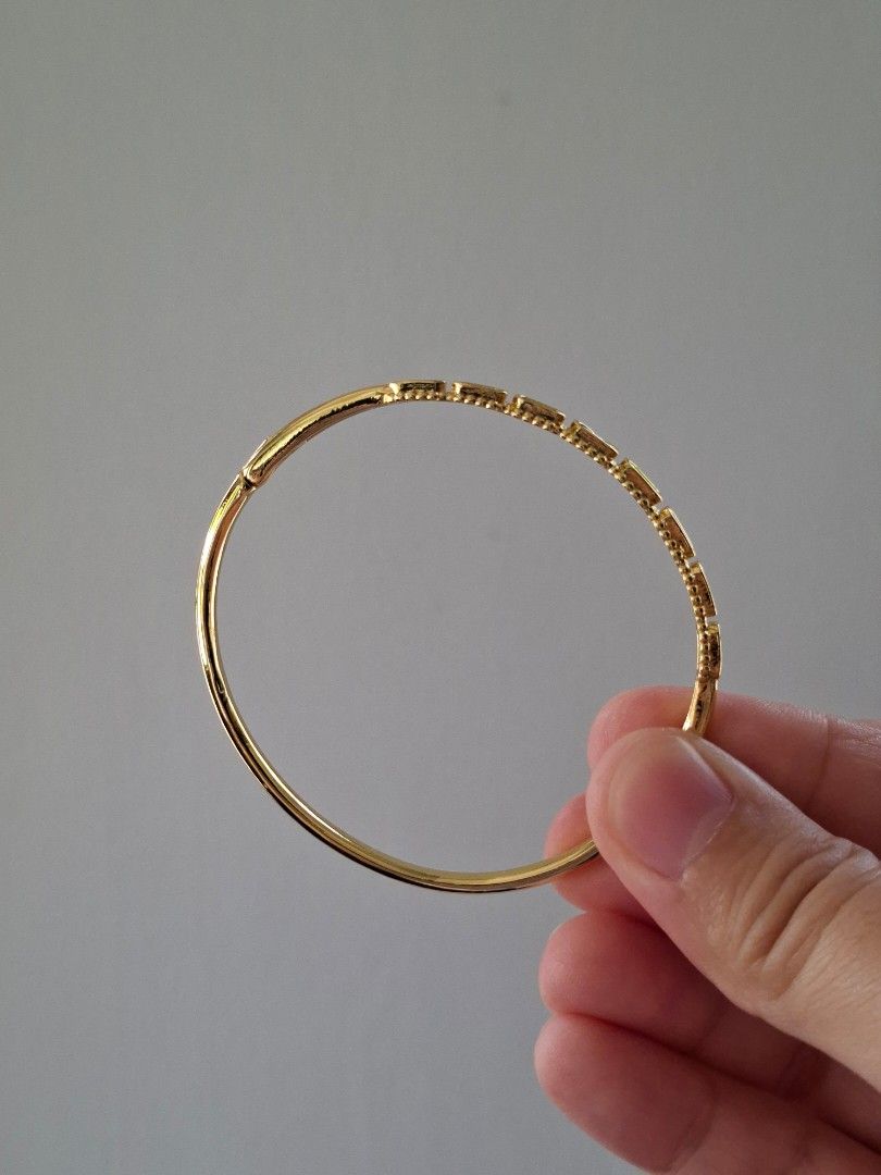 Gold Cube Designs Bangle Bracelet (Category: Bracelets) located in Dasmarinas. Submitted by danabrie22 (Listing ID 1464992460, Image 2). Description: very well-made, excellent crafstmanship 10/10 condition brand new stainless steel & crystal-colored cubic zirconia stones made in Hongkong.