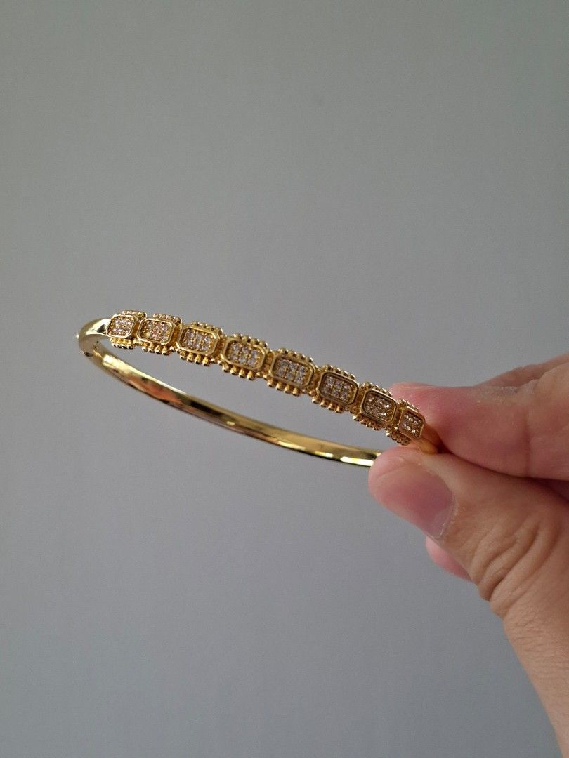 Gold Cube Designs Bangle Bracelet (Category: Bracelets) located in Dasmarinas. Submitted by danabrie22 (Listing ID 1464992460, Image 1). Description: very well-made, excellent crafstmanship 10/10 condition brand new stainless steel & crystal-colored cubic zirconia stones made in Hongkong.
