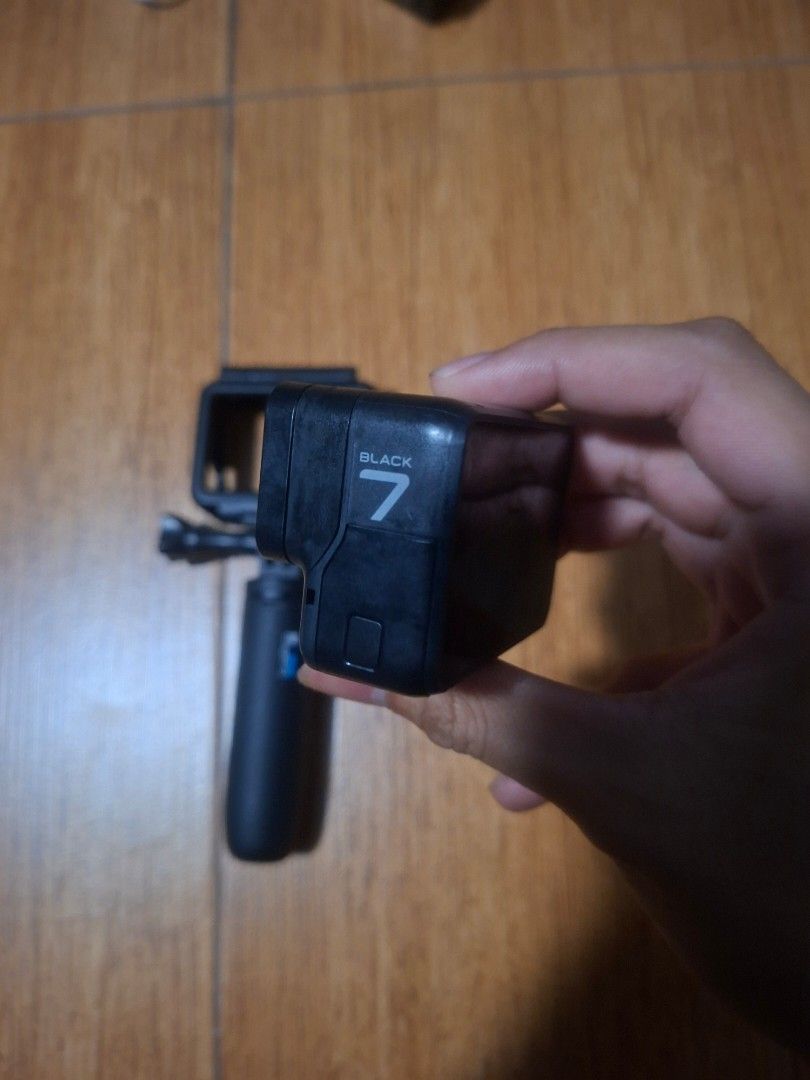 GoPro Hero 7 Black (Category: Cameras) located in Quezon City. Submitted by snuffster (Listing ID 1464983552, Image 2). Description: - Model: GoPro Hero7 Black action camera - Included Accessories: Protective frame mount and short hand grip - Nagcharge parin yung unit, okay battery life pa naman - Condition: Fully working screen and battery charges to 100%; body has normal signs of handling - Ideal for: Compact, on-the-go video shooting and outdo