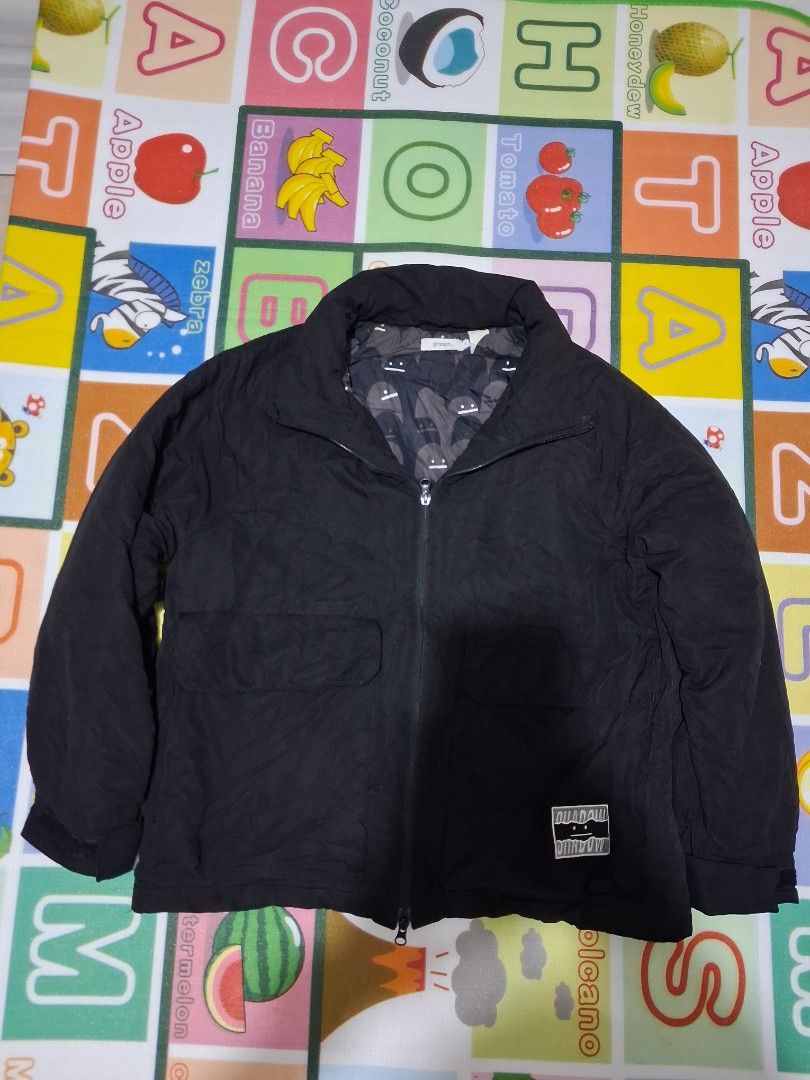 Graniph Beautiful Shadows Padded Blouson Jacket Size L (Category: Coats, Jackets and Outerwear) located in Manila. Submitted by rossthrift (Listing ID 1465130956, Image 2). Description: - Brand/Model: Graniph Padded Blouson Jacket - Color: Black - Size: Large (L) - Design: Fun face graphic on the back with a small graphic patch near the hem - Lining: Stylish all-over shadow character pattern on the inner lining - Features: Zip-up front, high coll