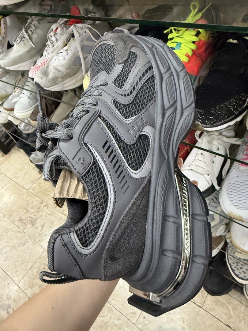 Grey Chunky Platform Sneakers Size 245 (Category: Sneakers) located in Manila. Submitted by fastlion.584bdf (Listing ID 1465070348, Image 1). Description: - Color: Dark grey with stylish silver chrome midsole accents - Material: Breathable mesh uppers and chunky textured soles - Features: Lace-up closure, reflective heel pull tab, and waffle tread pattern for grip - Size: 245 stamped on the sole - Condition: Minor wear on soles, still in great pr