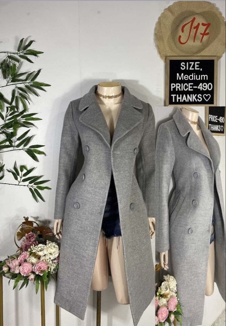 Grey Double-Breasted Long Wool Coat Medium (Category: Coats, Jackets and Outerwear) located in Imus. Submitted by anggeshop (Listing ID 1465051500, Image 1). Description: - Color: Classic Grey - Size: Medium - Style: Double-breasted button front, notched lapels, and structured waistline - Length: Mid-length - Material: Heavy fabric, ideal for colder weather - Condition: Excellent / Ready to ship .