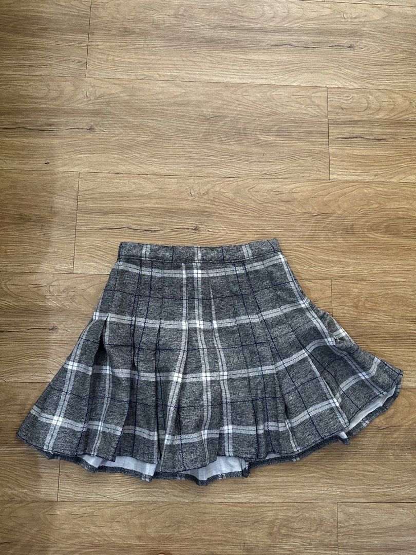 Grey plaid pleated mini skirt (Category: Skirts) located in Las Pinas. Submitted by petiteclothes_2000 (Listing ID 1465007171, Image 1). Description: - HQ! - thick! - Grey and white plaid pattern with thin blue lines - Classic pleated style with a structured waistband - Soft textured fabric and flattering flared silhouette - Versatile for casual outfits or school-inspired looks - Easy to pair with oversized sweaters and basic tees.