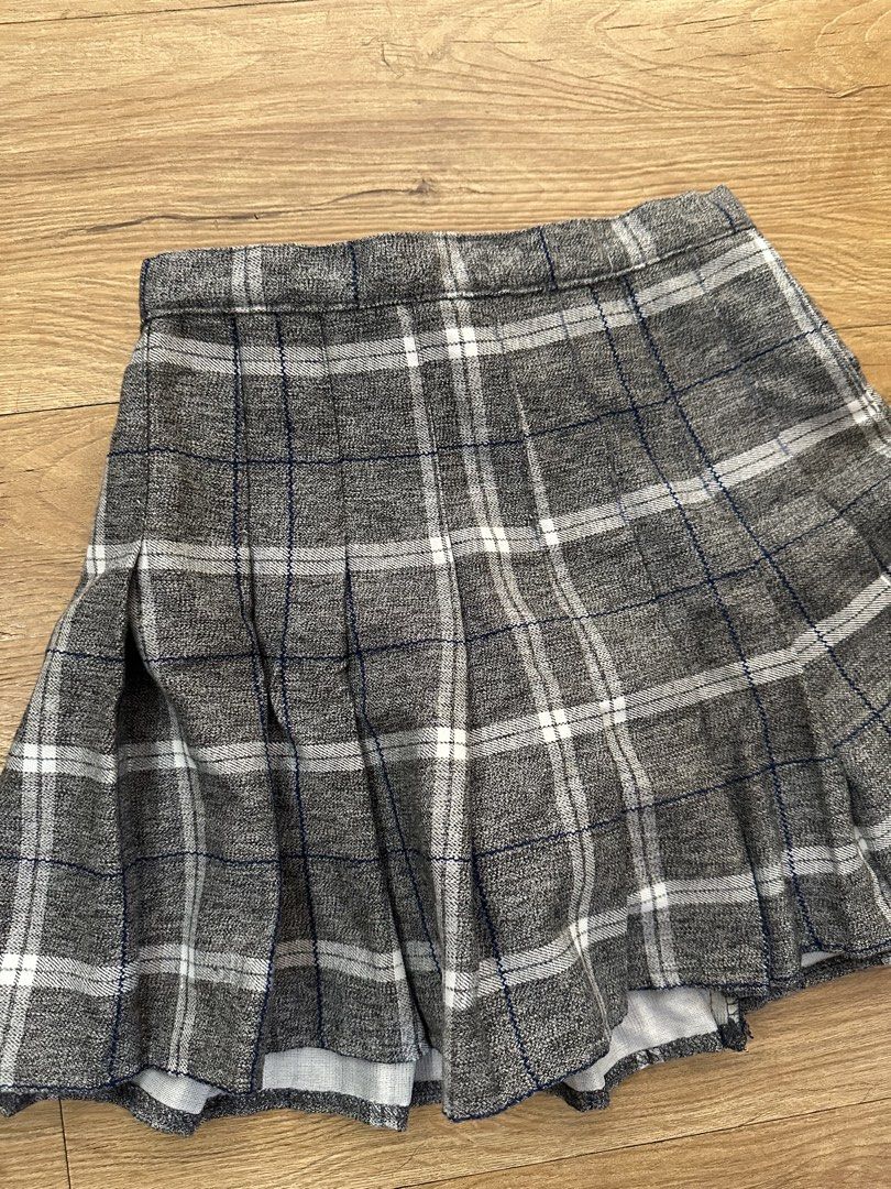 Grey plaid pleated mini skirt (Category: Skirts) located in Las Pinas. Submitted by petiteclothes_2000 (Listing ID 1465007171, Image 2). Description: - HQ! - thick! - Grey and white plaid pattern with thin blue lines - Classic pleated style with a structured waistband - Soft textured fabric and flattering flared silhouette - Versatile for casual outfits or school-inspired looks - Easy to pair with oversized sweaters and basic tees.