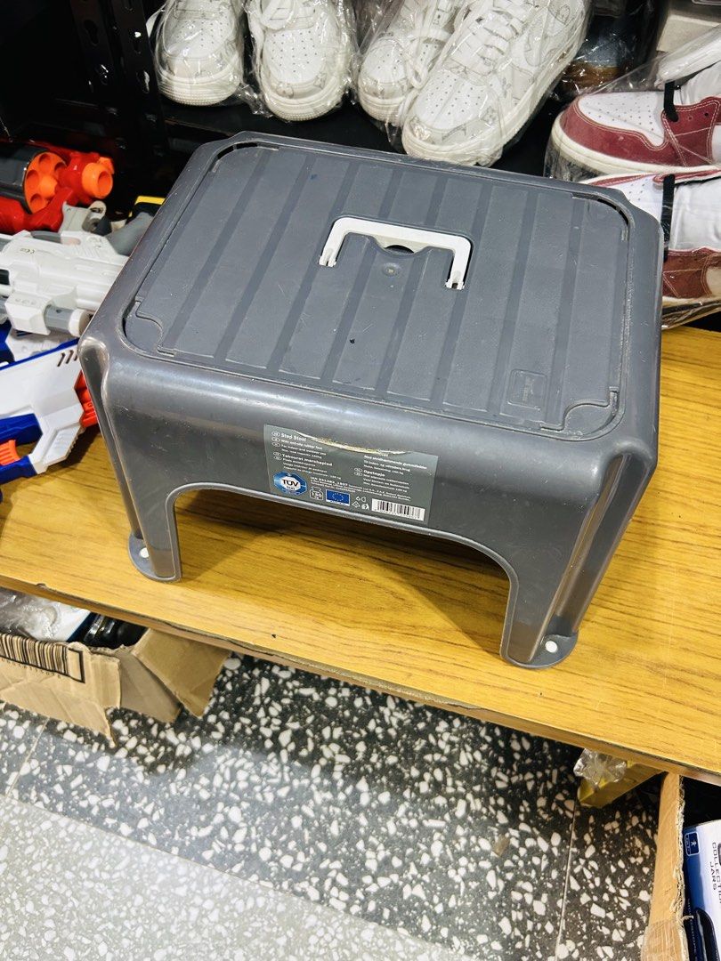 Grey plastic step stool with carry handle (Category: Ladders & Steps) located in Manila. Submitted by starbalesukandjapansurplus (Listing ID 1464995280, Image 2). Description: - Color: Grey - Material: Heavy-duty, solid plastic - Portability: Built-in folding handle on top for easy carrying - Safety Features: Textured anti-slip top surface and rubber grips on legs - Condition: Brand new with original sticker label still attached - Versatility: Id