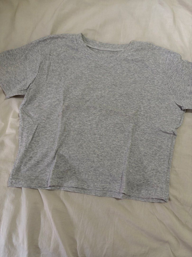 Grey Ribbed Crop T-Shirt (Category: Shirts) located in Paranaque City. Submitted by decluttering.pque (Listing ID 1465002029, Image 1). Description: Fits S to M - Color: Grey - Style: Short-sleeve crop top with crew neckline & relaxed fit - Fabric: Soft, stretchy textured ribbed knit - Features: Comfortable for all-day wear, easy to match with high-waist bottoms.