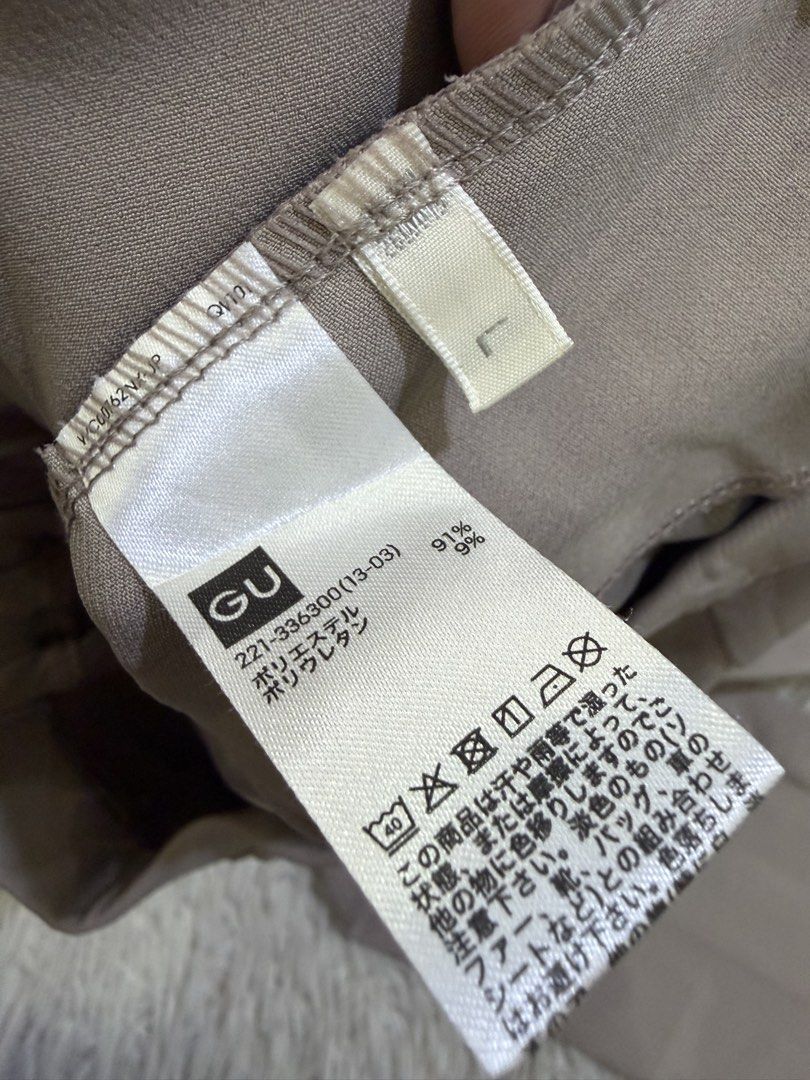 GU 2-Way Stretch Flare Pants (Category: Jeans) located in Manila. Submitted by kristinata44809 (Listing ID 1465075431, Image 2). Description: - Brand: GU - Style: Flare pants - Color: Greyish brown - Size: L - Material: 91% polyester, 9% polyurethane (stretch fabric) - Features: High waist design, front pockets - Condition: Brand new with original tags attached, never worn.