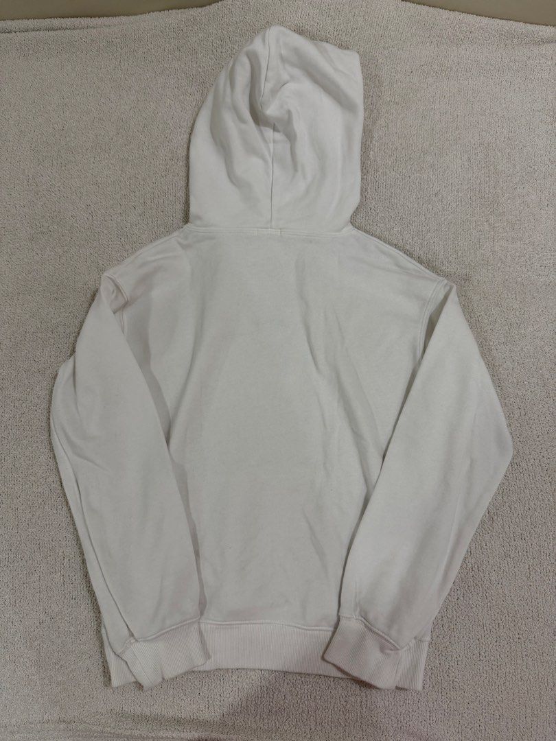 GU White Hoodie S (Category: Coats, Jackets and Outerwear) located in Subic. Submitted by kittysclosetsale (Listing ID 1465030871, Image 2). Description: - Brand: GU - Color: Plain White - Style: Classic pullover hoodie with matching drawstring hood and front pouch pocket - Material: 80% cotton, 20% polyester blend; Ribbing has 96% cotton, 4% spandex - Fit/Feel: Comfortable everyday sweatshirt, great for layering - Condition: Brand new / Excellen