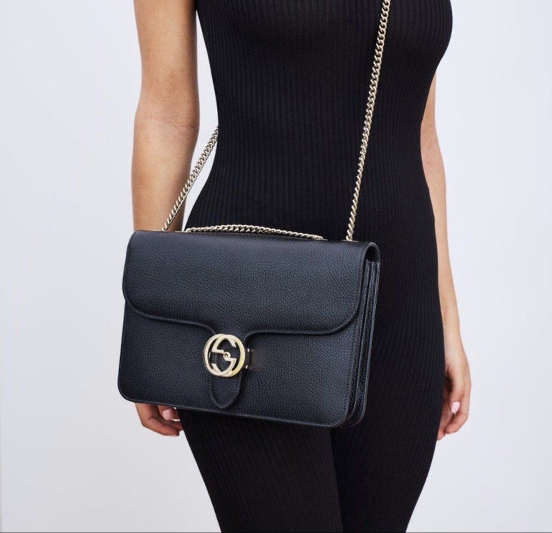 Gucci Black Leather Shoulder Bag (Category: Luxury Bags & Wallets) located in Paranaque City. Submitted by egg_shells (Listing ID 1465052566, Image 1). Description: - Brand: Gucci - Material: Premium black grained leather - Hardware: Elegant light gold-tone chain strap and iconic interlocking GG front closure - Interior: Light-colored fabric lining with multiple compartments and a secure zip pocket - Design: Clean, structured, and timeless shape 