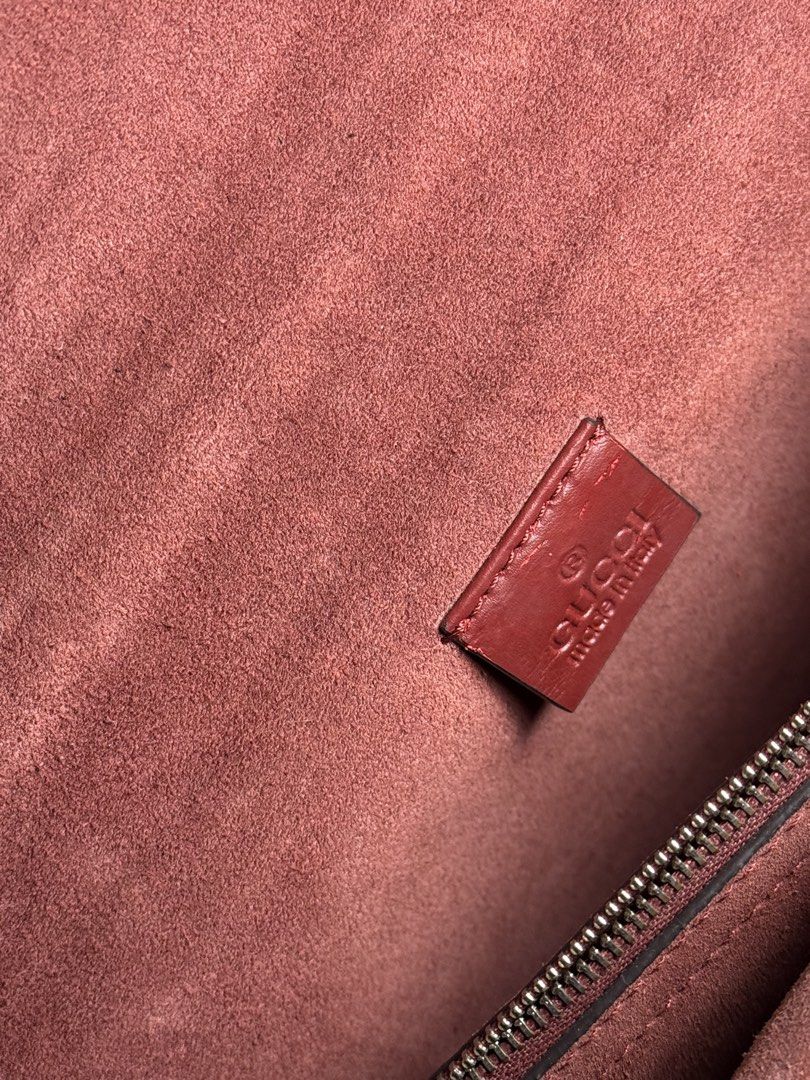 Gucci GG Supreme Geranium Dionysus Shoulder Bag (Category: Luxury Bags & Wallets) located in Manila. Submitted by zuji.ph (Listing ID 1464997448, Image 3). Description: - Brand: Gucci - Model: Dionysus Shoulder Bag - Material: GG Supreme canvas with red geranium floral print - Hardware: Antiqued silver-tone tiger head closure - Strap: Sliding chain (can be worn doubled or single) - Interior: Red suede lining with a central zipped compartment - Au