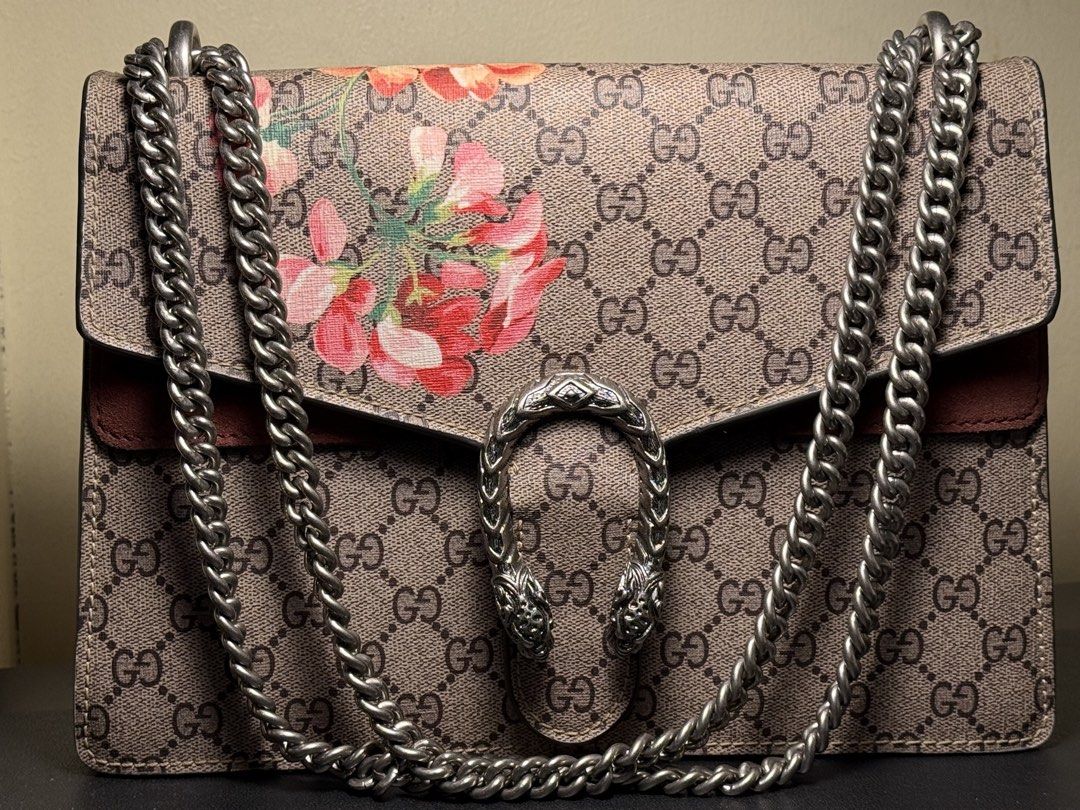 Gucci GG Supreme Geranium Dionysus Shoulder Bag (Category: Luxury Bags & Wallets) located in Manila. Submitted by zuji.ph (Listing ID 1464997448, Image 1). Description: - Brand: Gucci - Model: Dionysus Shoulder Bag - Material: GG Supreme canvas with red geranium floral print - Hardware: Antiqued silver-tone tiger head closure - Strap: Sliding chain (can be worn doubled or single) - Interior: Red suede lining with a central zipped compartment - Au