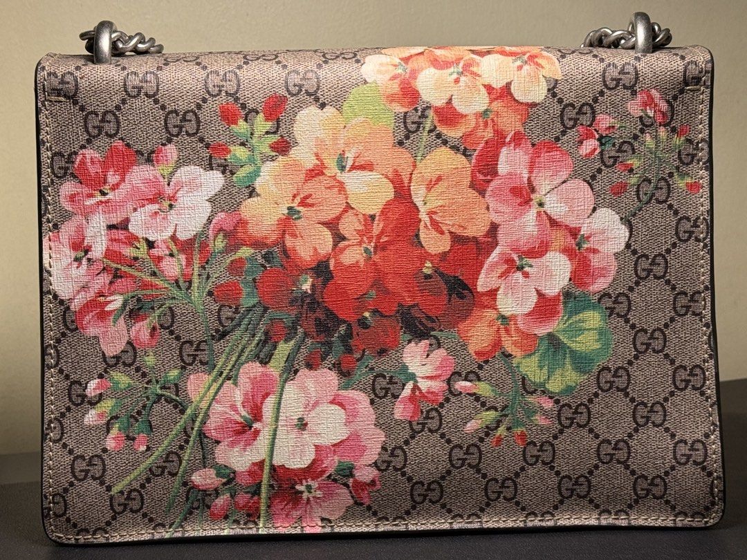 Gucci GG Supreme Geranium Dionysus Shoulder Bag (Category: Luxury Bags & Wallets) located in Manila. Submitted by zuji.ph (Listing ID 1464997448, Image 2). Description: - Brand: Gucci - Model: Dionysus Shoulder Bag - Material: GG Supreme canvas with red geranium floral print - Hardware: Antiqued silver-tone tiger head closure - Strap: Sliding chain (can be worn doubled or single) - Interior: Red suede lining with a central zipped compartment - Au