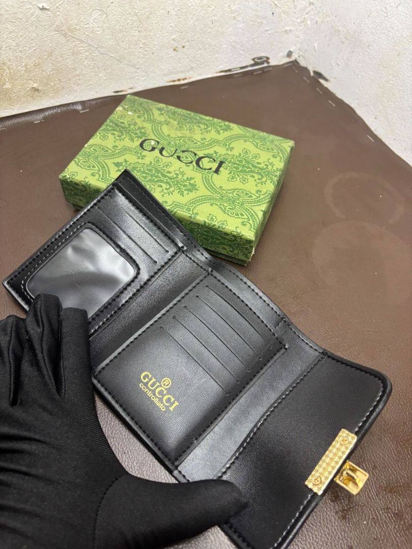 Gucci GG Supreme Padlock Wallet | Brown (Category: Wallets & Card Holders) located in Bacoor. Submitted by fafofa (Listing ID 1465103001, Image 2). Description: Compact Gucci-style wallet featuring GG Supreme coated canvas, a brown leather flap, and a distinctive gold-tone padlock closure. • GG Supreme coated canvas • Brown leather flap • Gold-tone padlock closure • Compact wallet design • Includes box .