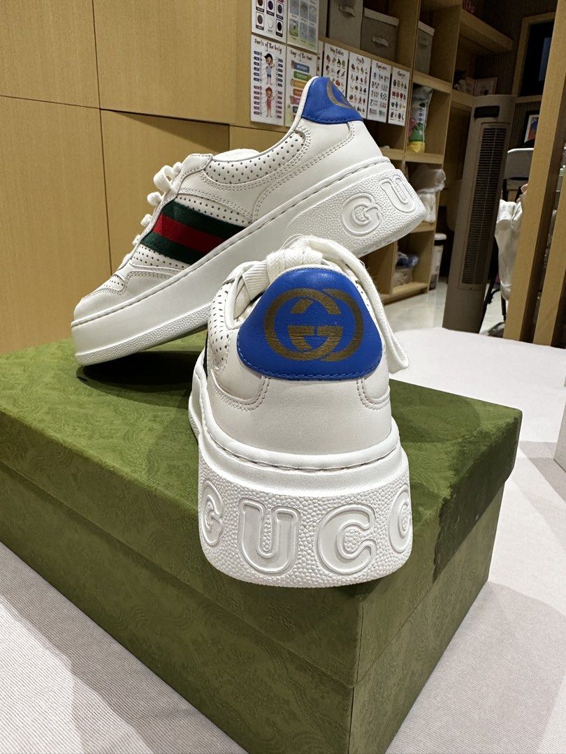 Gucci White Leather Platform Sneakers with Web Stripe Size 38 (Category: Sneakers) located in Ilagan. Submitted by whiskyandeevie (Listing ID 1465081403, Image 3). Description: - Brand: Gucci (Guaranteed Original) - Style: White leather chunky platform sneakers - Size: 38 (size sticker still intact on bottom soles) - Details: Signature green and red web stripe on sides, blue heel tab with gold interlocking G logo, embossed branding on sole - Cond