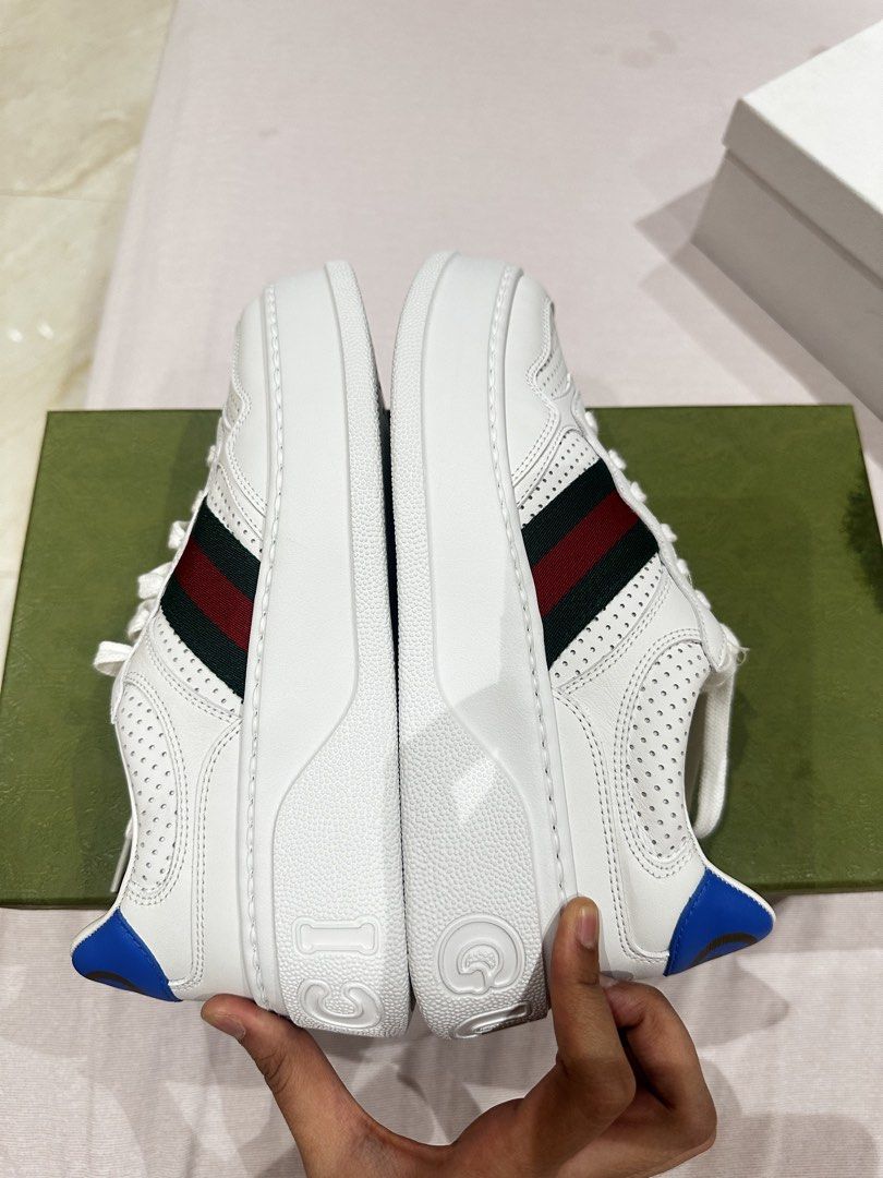 Gucci White Leather Platform Sneakers with Web Stripe Size 38 (Category: Sneakers) located in Ilagan. Submitted by whiskyandeevie (Listing ID 1465081403, Image 2). Description: - Brand: Gucci (Guaranteed Original) - Style: White leather chunky platform sneakers - Size: 38 (size sticker still intact on bottom soles) - Details: Signature green and red web stripe on sides, blue heel tab with gold interlocking G logo, embossed branding on sole - Cond