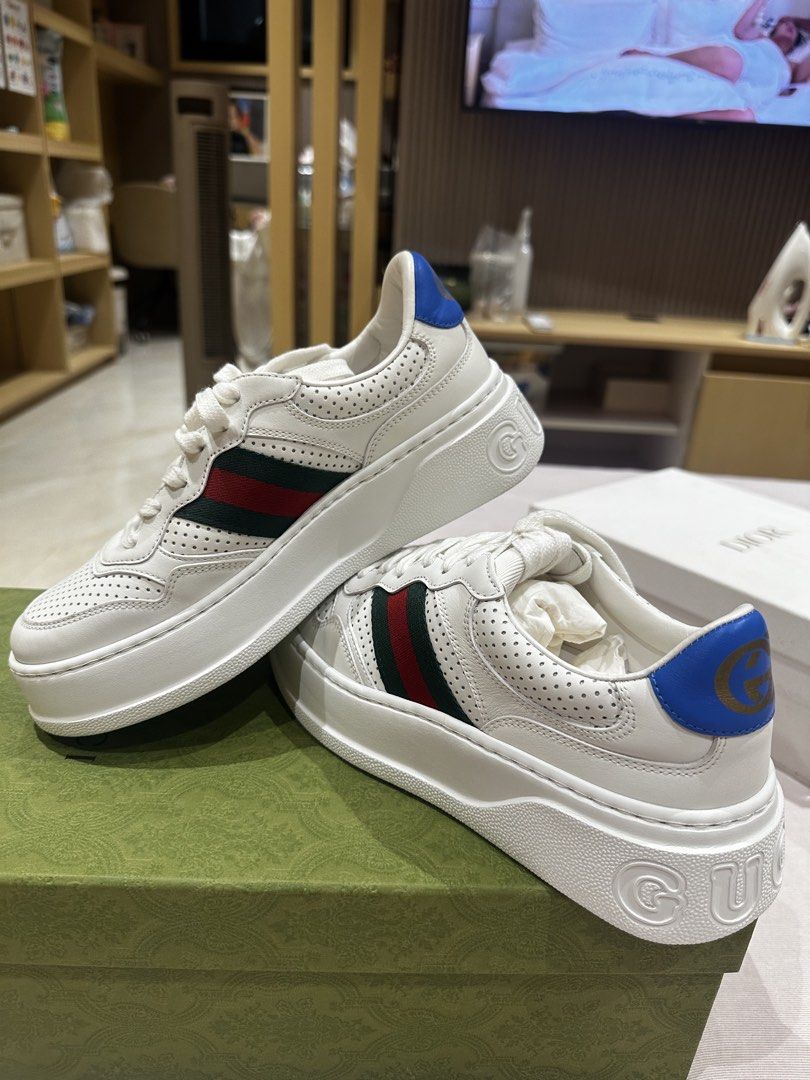 Gucci White Leather Platform Sneakers with Web Stripe Size 38 (Category: Sneakers) located in Ilagan. Submitted by whiskyandeevie (Listing ID 1465081403, Image 1). Description: - Brand: Gucci (Guaranteed Original) - Style: White leather chunky platform sneakers - Size: 38 (size sticker still intact on bottom soles) - Details: Signature green and red web stripe on sides, blue heel tab with gold interlocking G logo, embossed branding on sole - Cond