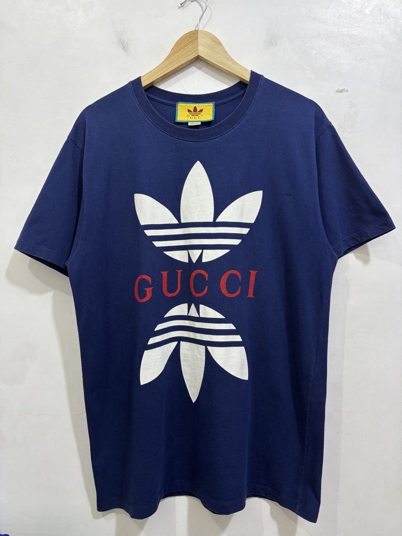 Gucci X Adidas tee (Category: Luxury Accessories) located in Taytay. Submitted by leanmark103093 (Listing ID 1465126486, Image 1). Description: Gucci ❌ Adidas tee Authentic Medium on tag W22 L29 Excellent Condition No issue 📩📩📩📩.