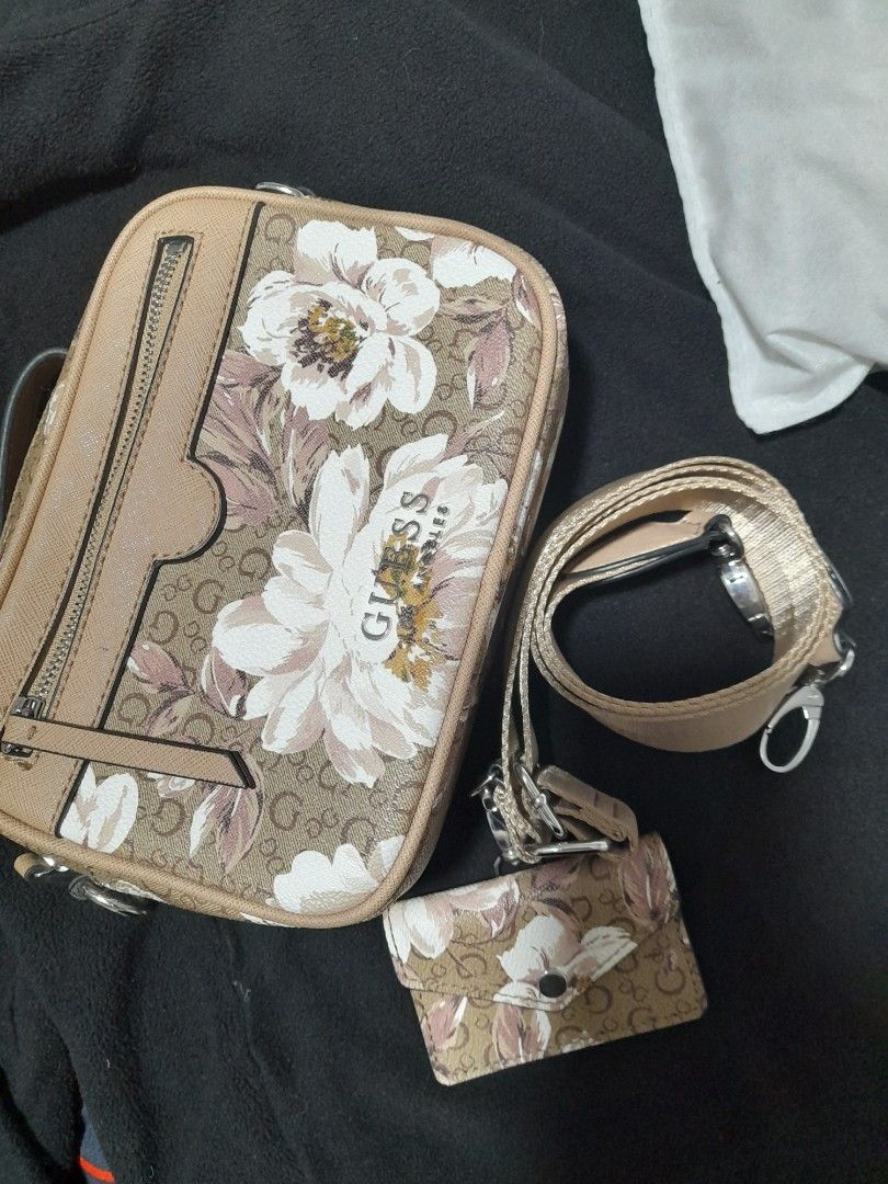 GUESS bag with purse (Category: Cross-body Bags) located in Cavite. Submitted by csdepot (Listing ID 1464973421, Image 3). Description: Design: Floral GUESS bag with purse Color: Beige/brown (as seen on images) Size: 5inches (H) x 7inches (L) Zipper type Cute Bag for teens and Young adults alike Water repellant material Bought from Canada.