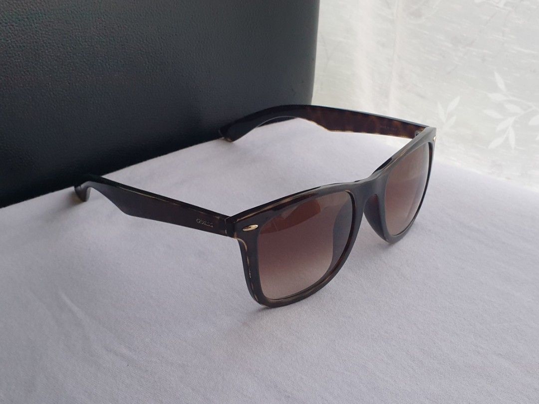 GUESS Dark Tortoise Sunglasses (Category: Sunglasses & Eyewear) located in Quezon City. Submitted by WasalakTwo (Listing ID 1465154133, Image 3). Description: Bought in Japan Made in Italy Goodcondition Clean and presentable Open for delivery nationwide.