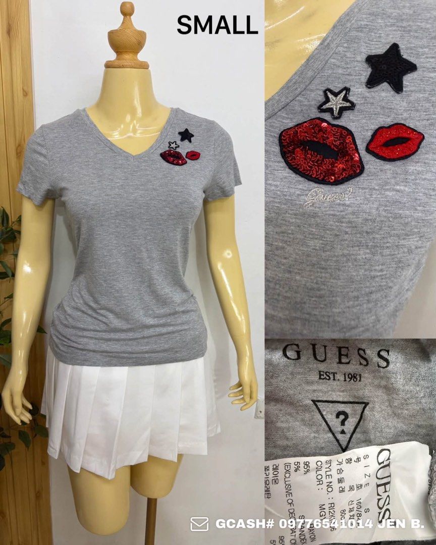 Guess Grey Graphic T-Shirt Size Small (Category: Tshirts & Polo Shirts ) located in Tagum. Submitted by bernardino49694 (Listing ID 1465005215, Image 1). Description: - Brand: Guess - Color: Grey - Size: Small - Material: 95% Rayon, 5% Spandex (soft & stretchy) - Neckline: V-neck - Details: Embroidered and sequin lip & star patches on the left chest - Branding: Official logo printed below the back collar with original tag inside - Condition: Bran