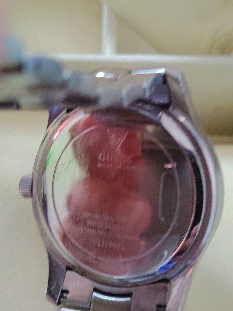Guess Stainless Steel Multi-Function Watch (Category: Women's Watches) located in Paranaque City. Submitted by lucille1280 (Listing ID 1464992671, Image 3). Description: - Brand: Guess - Material: Stainless steel silver-tone linked bracelet - Dial: White textured-negotiable dial with Arabic numerals - Features: Multi-function sub-dials tracking month, day of the week, date, and moon phase - Closure: Clasp closure - Back Case: Engraved with brandi