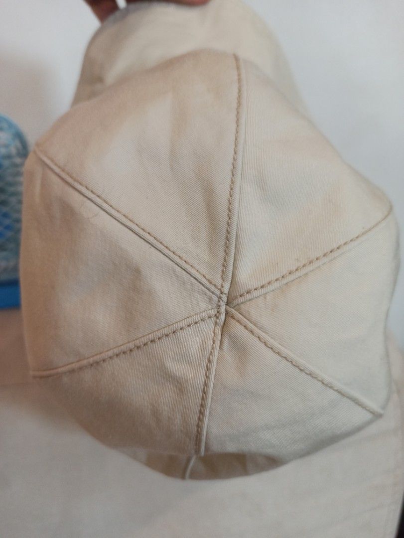 Guy Laroche Paris Beige Bucket Hat (Category: Hats & Beanies) located in Caloocan City. Submitted by rtarellano (Listing ID 1464991991, Image 2). Description: - Brand: Guy Laroche Paris - Color: Versatile neutral beige - Design: Six-panel crown with stylish contrast topstitching - Detail: Branded white fabric label on the side seam - Function: Wide brim design, perfect for sunny outdoor days - Condition: Excellent.