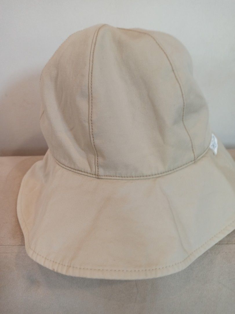 Guy Laroche Paris Beige Bucket Hat (Category: Hats & Beanies) located in Caloocan City. Submitted by rtarellano (Listing ID 1464991991, Image 3). Description: - Brand: Guy Laroche Paris - Color: Versatile neutral beige - Design: Six-panel crown with stylish contrast topstitching - Detail: Branded white fabric label on the side seam - Function: Wide brim design, perfect for sunny outdoor days - Condition: Excellent.