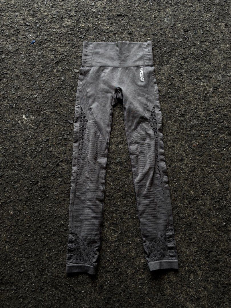Gymshark Grey Seamless Leggings (Category: Activewear) located in Caloocan City. Submitted by neweagle-424b (Listing ID 1465101184, Image 2). Description: Gymshark grey seamless leggings. High-waisted design with contour shading details along the legs and subtle dot patterns. White Gymshark logo printed on the hip and rear waistband, showing some cracking on the prints from wear. Breathable ribbed fabric paneling throughout. Stretchy material, co