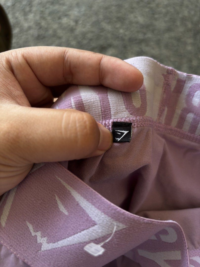 Gymshark Purple Leggings (Category: Activewear) located in Caloocan City. Submitted by neweagle-424b (Listing ID 1465102131, Image 3). Description: - Brand: Gymshark - Color: Pastel purple - Fit: Full length with a supportive wide elastic waistband - Design: Features branded Gymshark lettering and logo - Material: Soft, stretchy, and movement-friendly fabric - Condition: Great for workouts, yoga, or casual wear - Easy to match: Pairs perfectly wi
