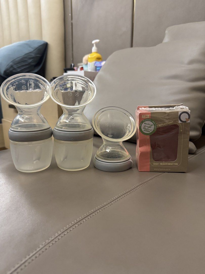 Haakaa Silicone Breast Pump Set (Category: Breastfeeding & Bottle Feeding) located in Manila. Submitted by lovelyiceblue (Listing ID 1465075210, Image 1). Description: - Complete Haakaa set: 2 silicone breast pumps with bases and 2 extra pump attachment in box - Material: Safe, medical-grade silicone - Ideal for manual milk collection for nursing mothers - Condition: barely used.