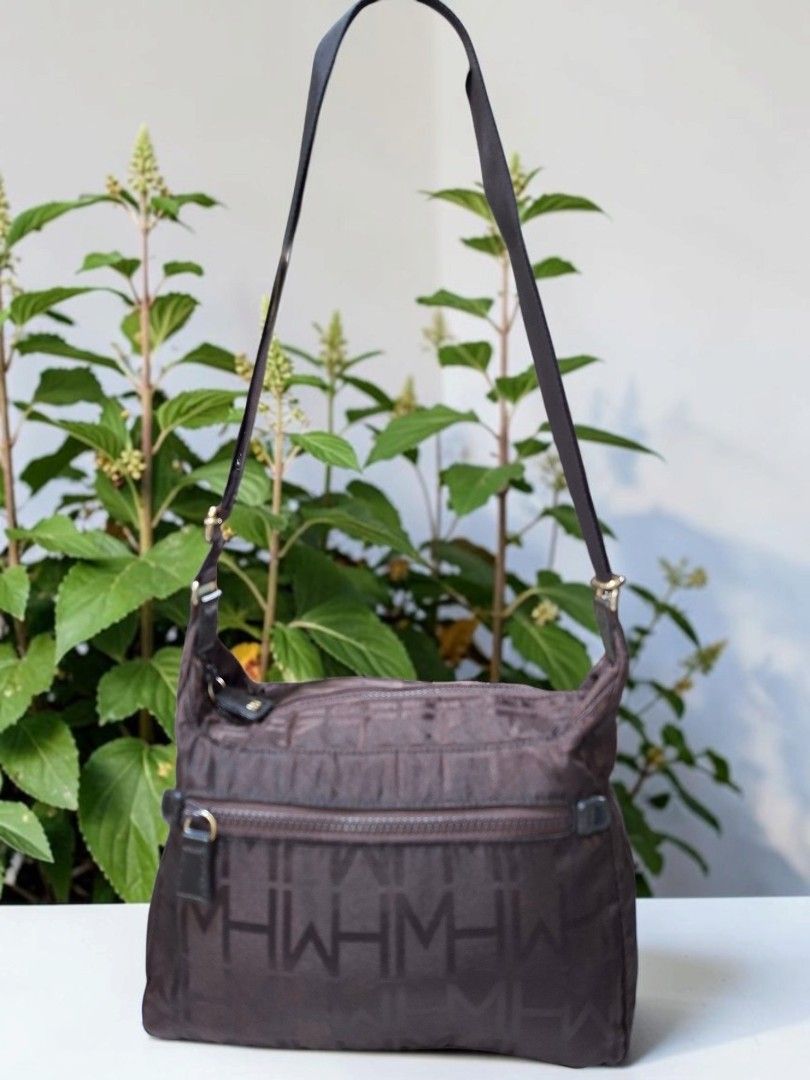 HANAE MORI BROWN NYLON SLING (Category: Cross-body Bags) located in Las Pinas. Submitted by annachiaonair2037 (Listing ID 1465008322, Image 2). Description: HANAE MORI MONOGRAM NYLON CROSDBODY FROM JAPAN YKK ZIP ADJUSTABLE STRAP H 8" L 10" W 5" Disclaimer: I am not affiliated with, associated with, or authorized by any of the brands featured posted. Any mention of brand names, trademarks, or logos is solely for identification and reference purpos
