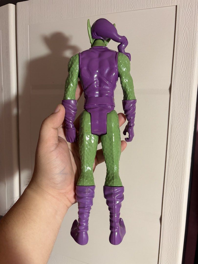 Hasbro Green Goblin Action Figure Marvel 2014 (Category: Figurines & Statues) located in Plaridel. Submitted by moddedjarvis (Listing ID 1465169717, Image 2). Description: - Item: Hasbro Green Goblin Action Figure - Release Year: 2014 - Condition: Excellent display piece with verified copyright stamps under the foot - Details: Iconic purple and green outfit made with solid plastic build - Accessories: Includes pumpkin accessory - Perfect for: Spi