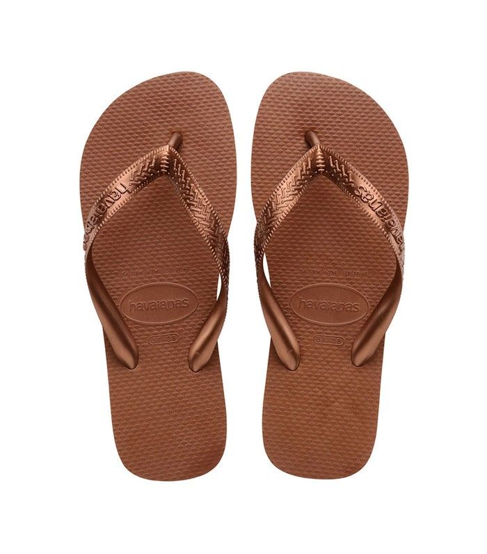 Havaianas Top Tiras Rust 37/38 (Category: Slippers and slides) located in Arayat. Submitted by idraine11 (Listing ID 1465103387, Image 1). Description: - Authentic Havaianas Slim Metallic flip flops - Color: Bronze - Size: USA 7, BRA 37/38 EUR 39/40 - Condition: Brand new and unworn - Features: Classic textured rice pattern footbed, shiny metallic straps, and embossed logo - Inclusions: Ziplock, hanger SF Shouldered By Buyer.