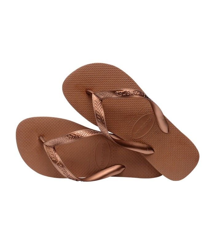 Havaianas Top Tiras Rust 37/38 (Category: Slippers and slides) located in Arayat. Submitted by idraine11 (Listing ID 1465103387, Image 2). Description: - Authentic Havaianas Slim Metallic flip flops - Color: Bronze - Size: USA 7, BRA 37/38 EUR 39/40 - Condition: Brand new and unworn - Features: Classic textured rice pattern footbed, shiny metallic straps, and embossed logo - Inclusions: Ziplock, hanger SF Shouldered By Buyer.