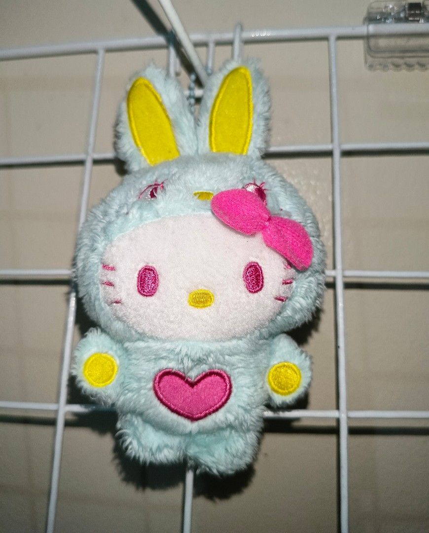 Hello Kitty Bunny Costume Plush Keychain with Pink Bow (Category: Plushies & Soft Toys) located in Pasig City. Submitted by sleepyfairy (Listing ID 1464975431, Image 1). Description: Hello Kitty bag charm I can give discount if you buy 3 plushie charms message me if you have questions about the item 🫶🏻 shipping fee shouldered by buyer 🩷.