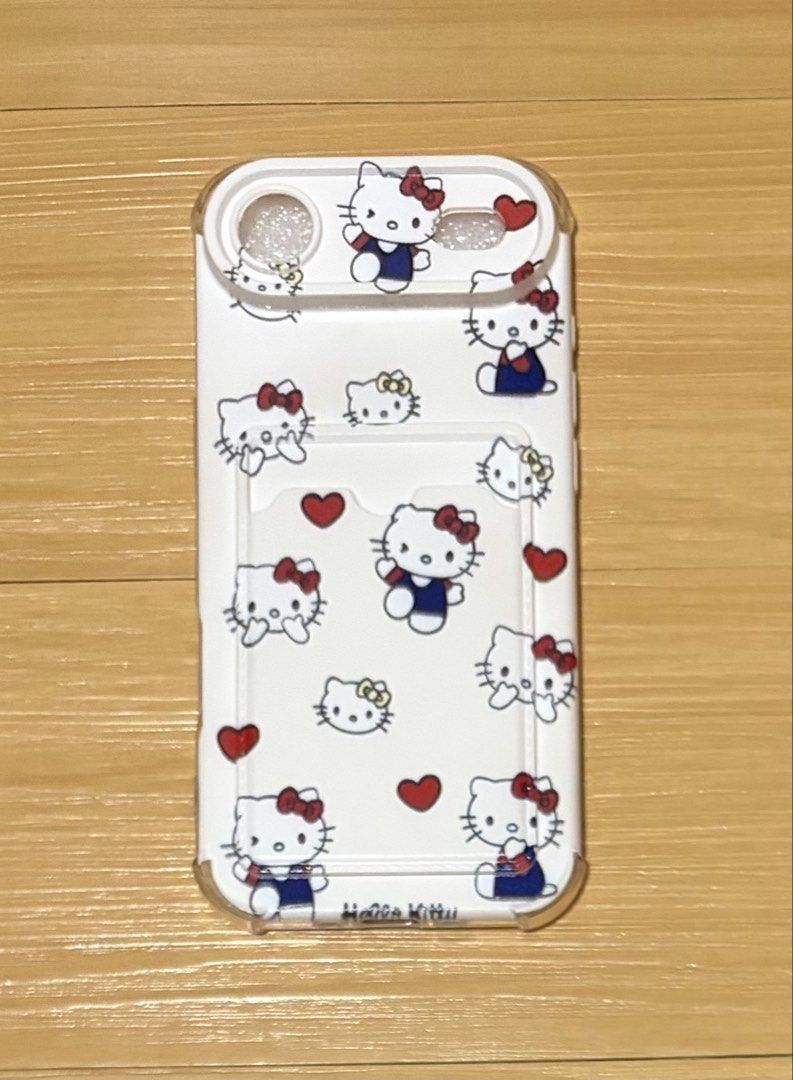 Hello Kitty Print iPhone Air Case (Category: Cases & Sleeves) located in Quezon City. Submitted by garagesale2026 (Listing ID 1465122986, Image 3). Description: - Unused - Compatible Model: iPhone 17 Air - Design: Cute Kitty print with red hearts - Feature: Built-in card holder slot at the back for convenient card storage - Silicone / Rubber Material.