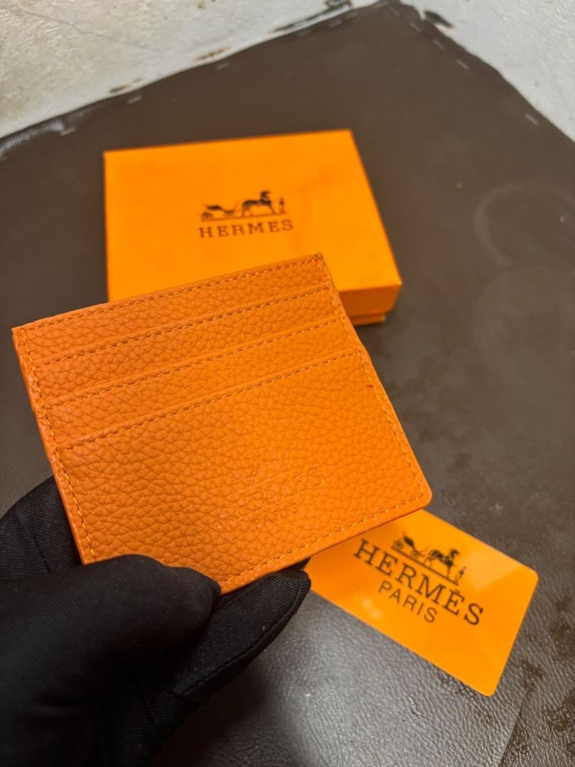 Hermès Leather Card Holder | Orange | With Box (Category: Wall Decor) located in Bacoor. Submitted by fafofa (Listing ID 1465102556, Image 1). Description: Hermès orange textured leather card holder featuring an embossed Hermès logo and a clean, compact design. • Orange textured leather • Embossed Hermès logo • Compact card holder design • Includes Hermès box • Includes branded card.