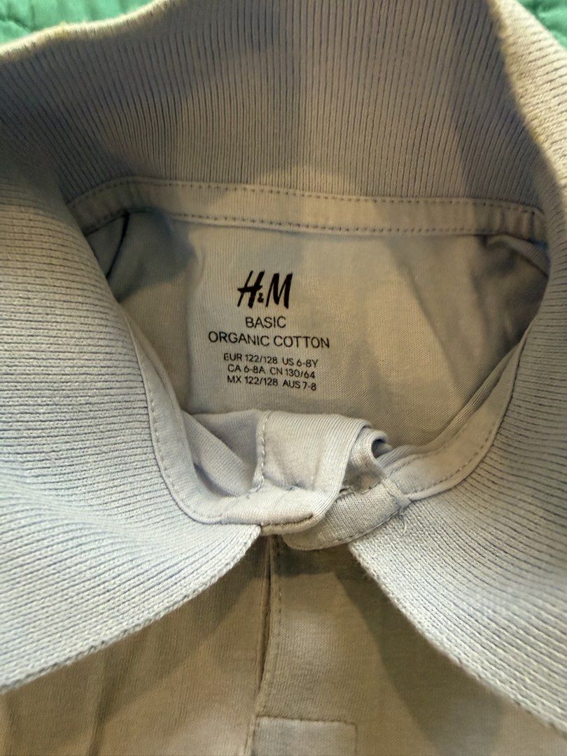 H&M Basic Organic Cotton Light Purple Polo Shirt (Category: Tshirts & Polo Shirts ) located in Quezon City. Submitted by krisallie (Listing ID 1465029947, Image 2). Description: - Brand/Model: H&M Basic Kids - Color: Light blue - Material: 100% Organic cotton - Size: EUR 122/128 (US 6-8Y) - Design: Short sleeves, ribbed collar, two-button placket - Condition: Excellent, simple and comfortable basic top.