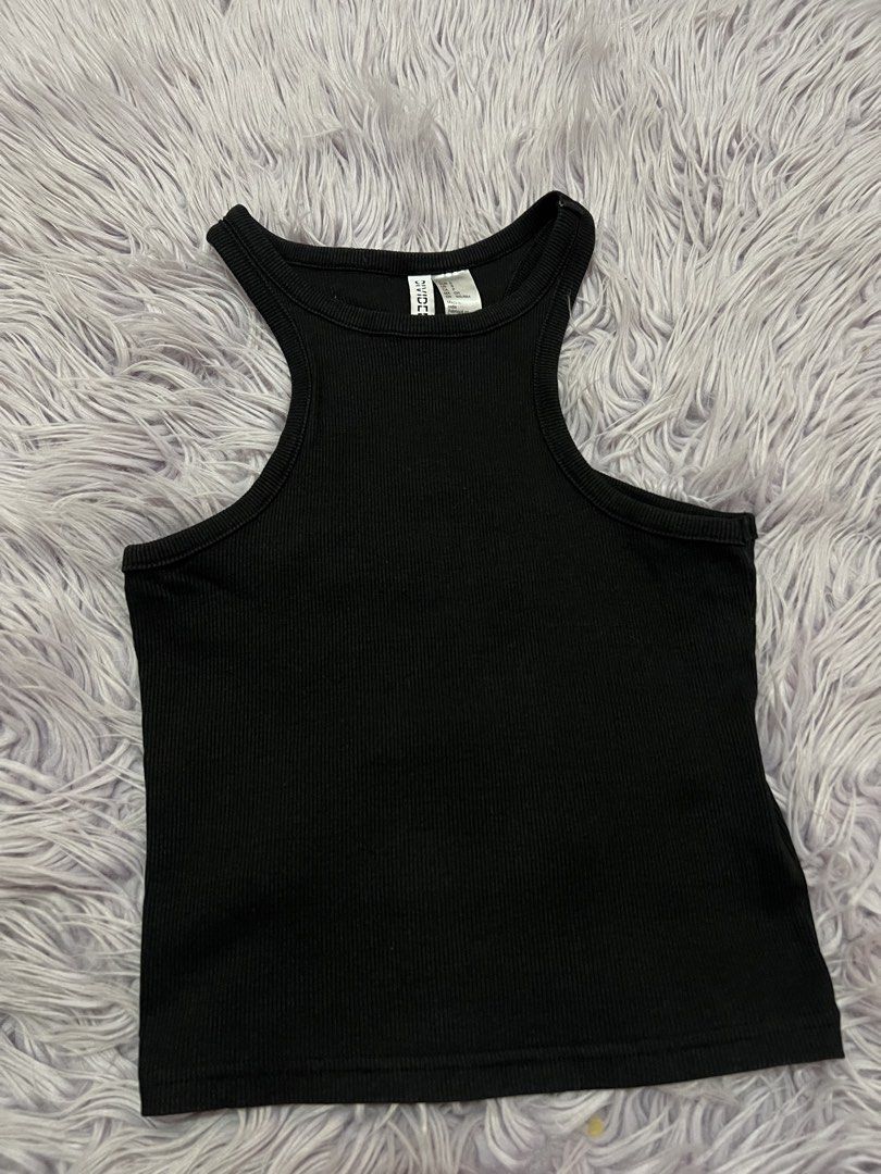 H&M Divided Black Ribbed Tank Top Size S (Category: Sleeveless) located in Cabanatuan. Submitted by imported2023 (Listing ID 1465078719, Image 1). Description: - Brand/Model: H&M Divided - Color: Black - Size: S (EUR S, US S, CN 165/88A) - Material: Soft, stretchy cotton - Style: Fitted racerback with high neckline - Condition: Excellent, clean, no flaws - Made in: India - Perfect go-to basic for everyday styling.