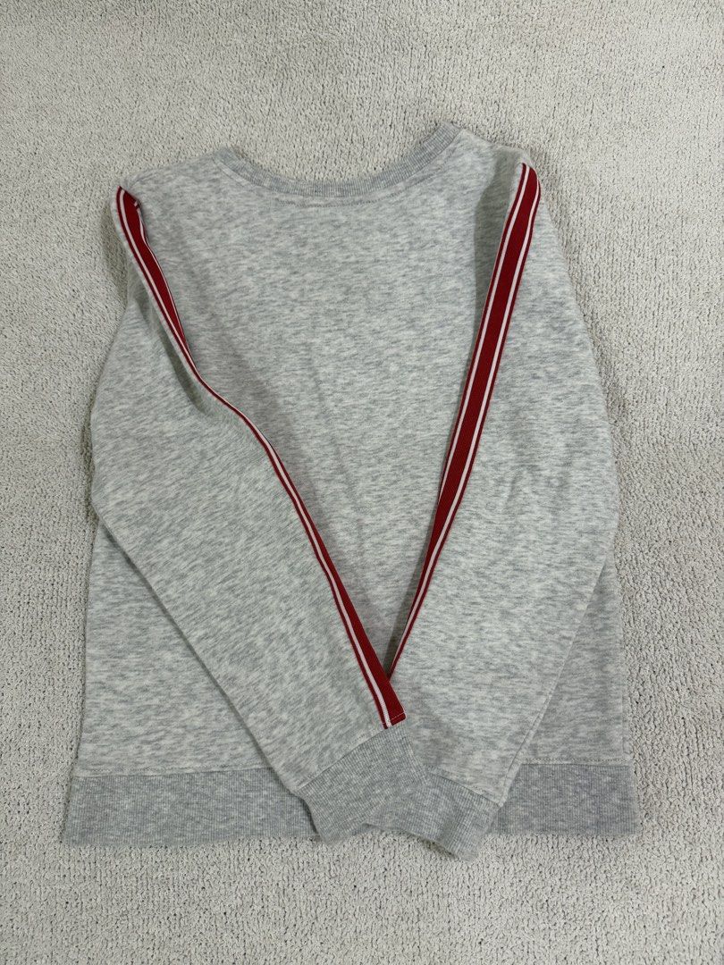 H&M Sweatshirt 8-10Y (Category: Babies & Kids Fashion) located in Subic. Submitted by kittysclosetsale (Listing ID 1465097182, Image 3). Description: - Brand: H&M - Size: EUR 134/140 / US 8-10 Years - Design: Cute cartoon mice with 'THE YEAR OF LUCK / THE LUNAR NEW YEARS CREW' text - Details: Red and white athletic stripes on sleeves, red ribbed inner collar - Material: Soft cotton blend with cozy fleece lining - Condition: Great casual top for e